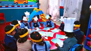 Pre-school students at EduVision School & Academy Shakargarh participating in a table-top activity for World Egg Day.