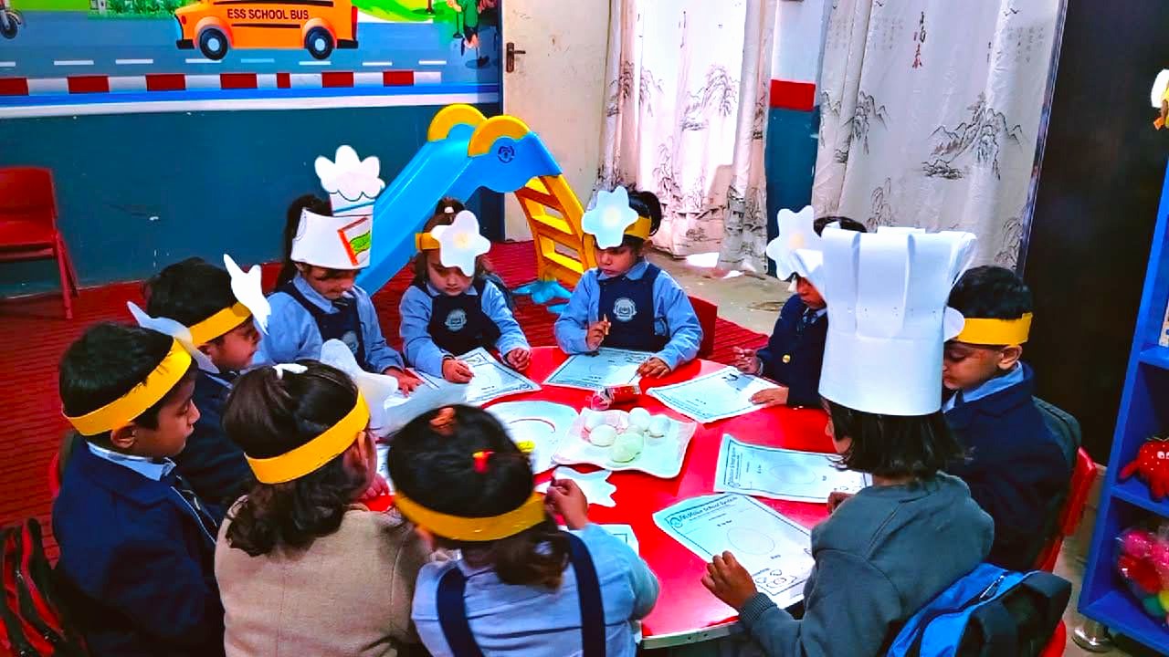 Pre-school students at EduVision School & Academy Shakargarh participating in a table-top activity for World Egg Day.