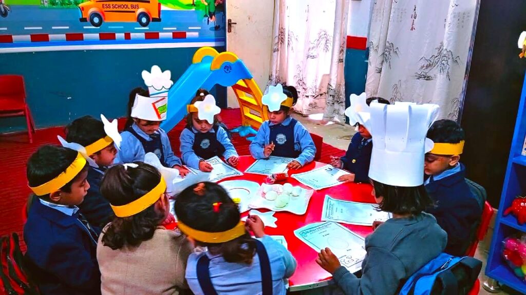 Pre-school students at EduVision School & Academy Shakargarh participating in a table-top activity for World Egg Day.