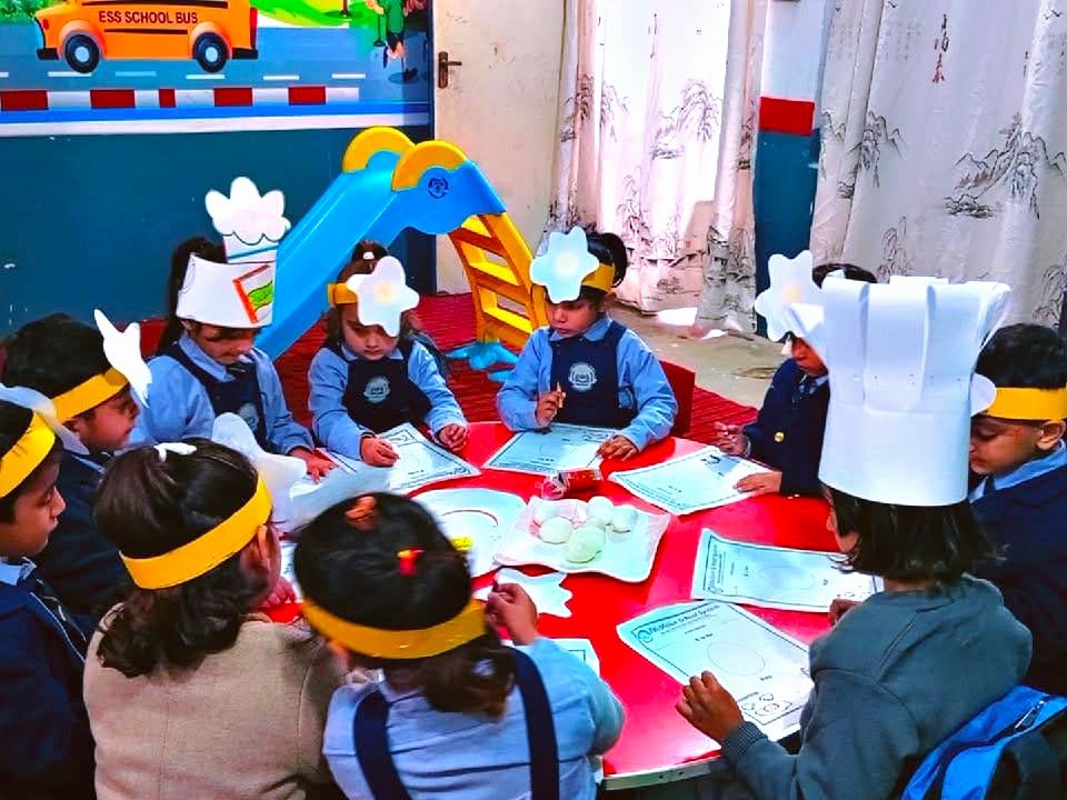 Pre-school students at EduVision School & Academy Shakargarh participating in a table-top activity for World Egg Day.